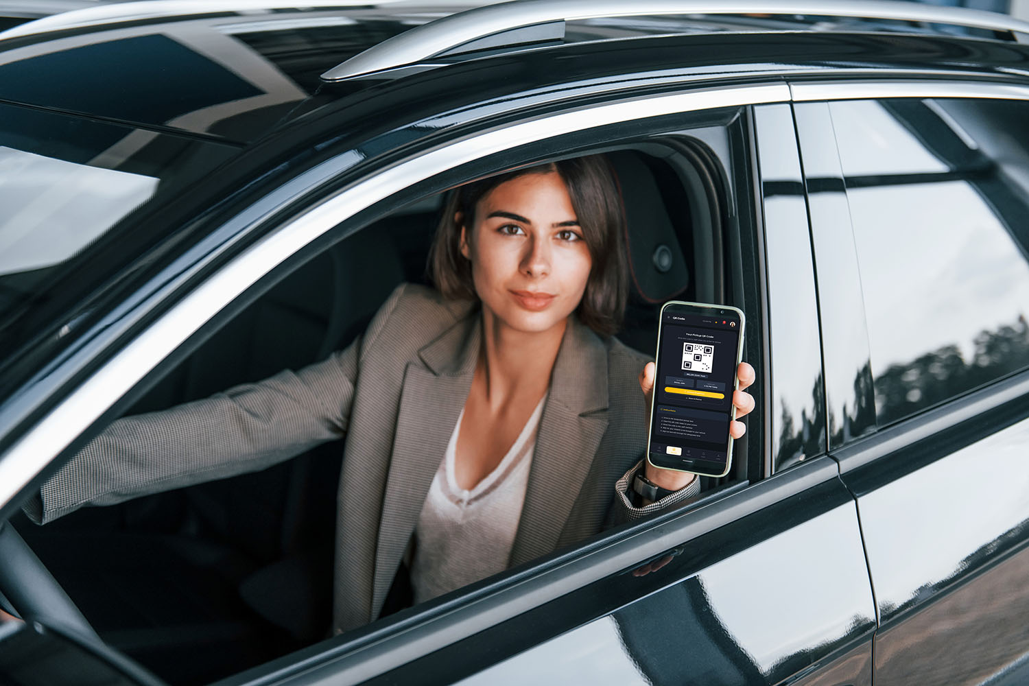 Staff member scanning QR code during student pickup